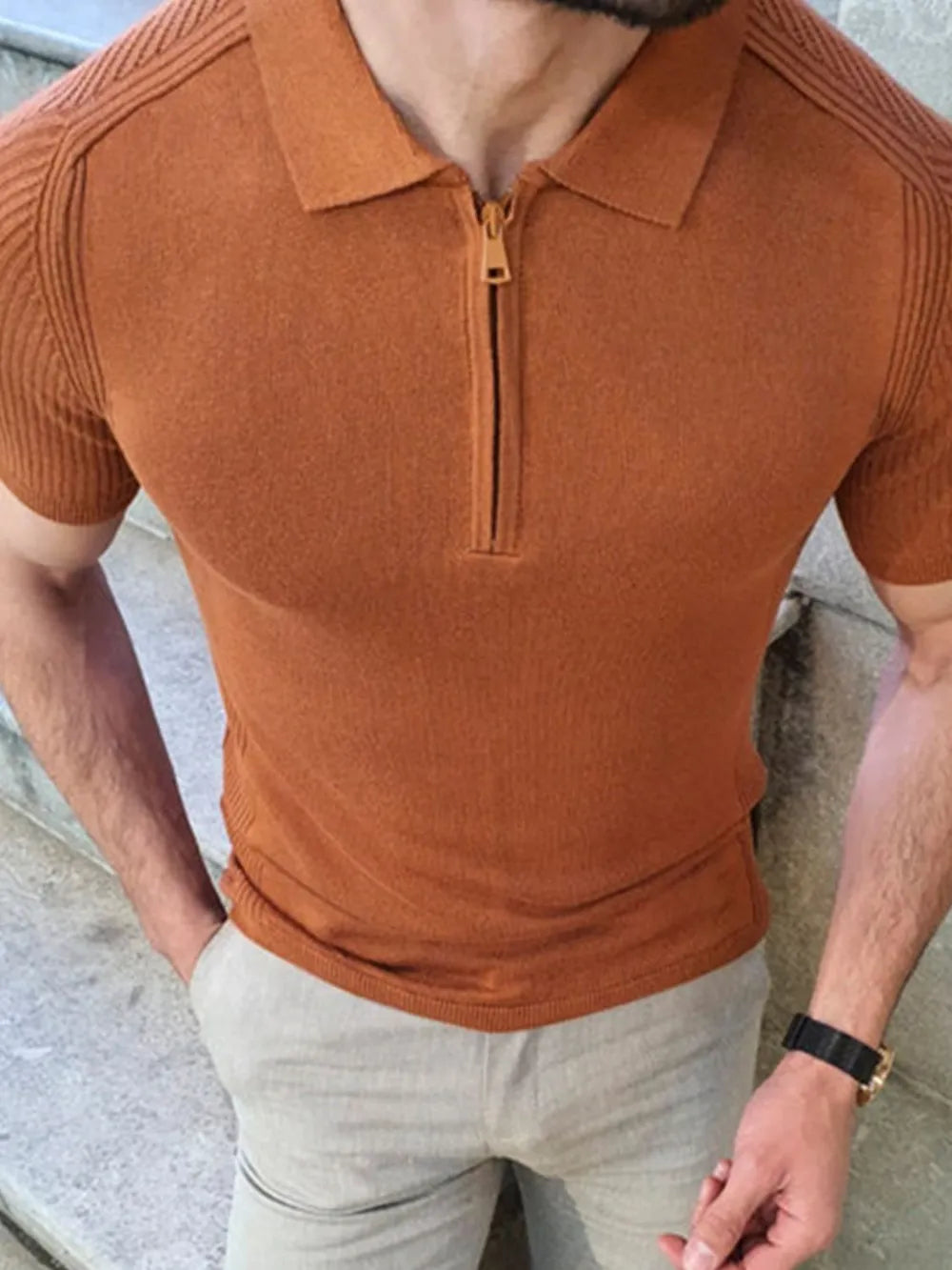Textured knit polo shirt in caramel with zip neck and short sleeves.