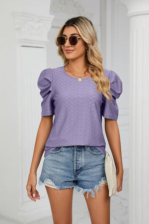 Purple perforated sleeve volume top with crewneck, styled with denim shorts.