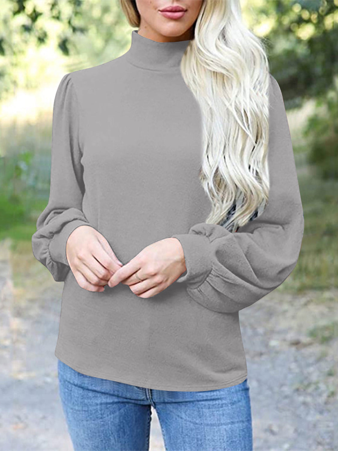 Gray mock neck top with puff sleeves and button back detail