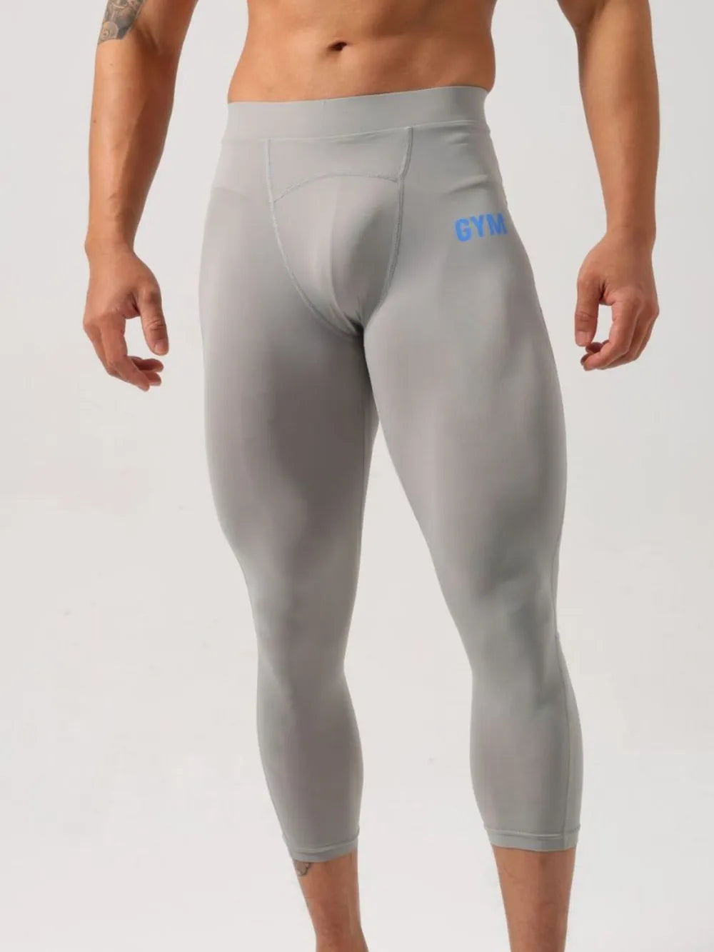 Gray compression capri leggings with blue GYM logo
