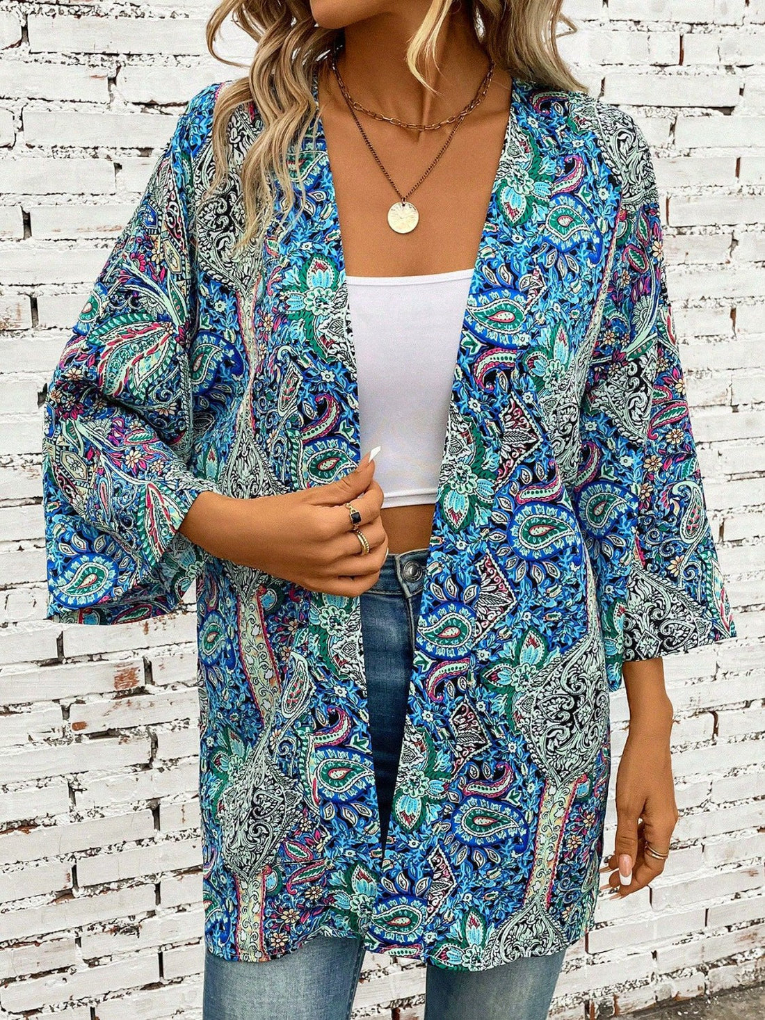 Teal paisley print kimono sleeve duster with open front and wide sleeves.