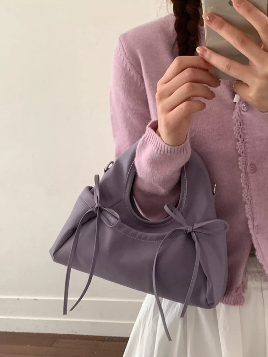 lavender crossbody bag with adjustable strap and not applicable