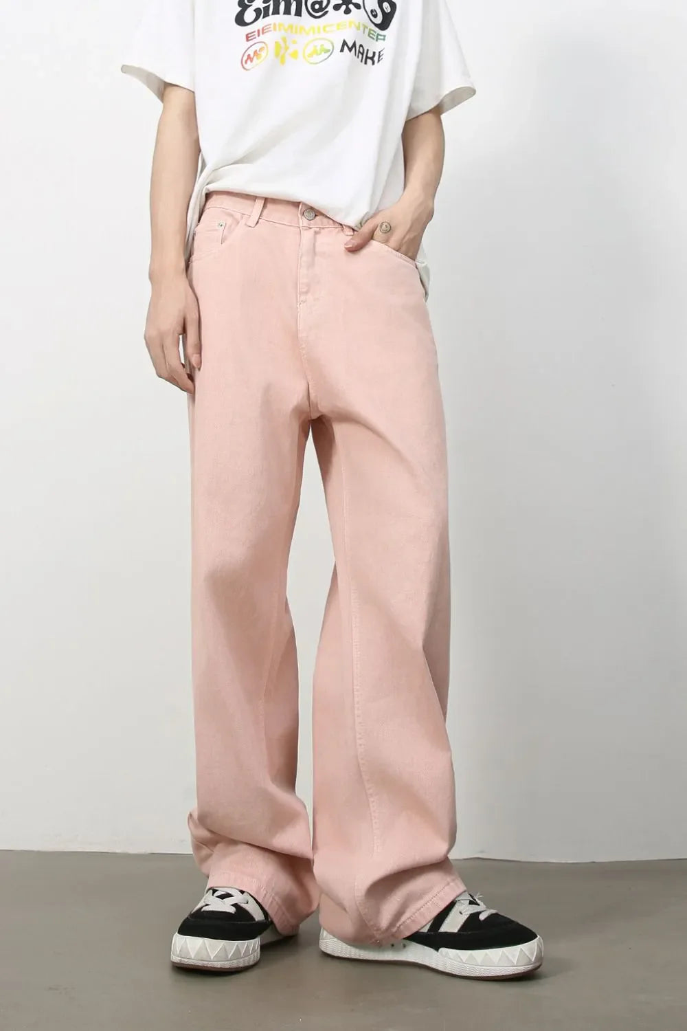 Flowing fit blush pink 100% cotton jeans with a relaxed cut.