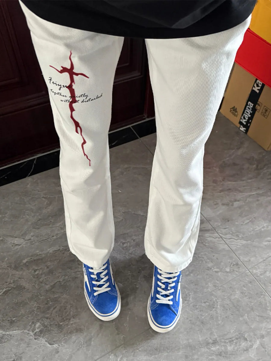 White casual sweatpants with red graphic print and text detail, men's fit.