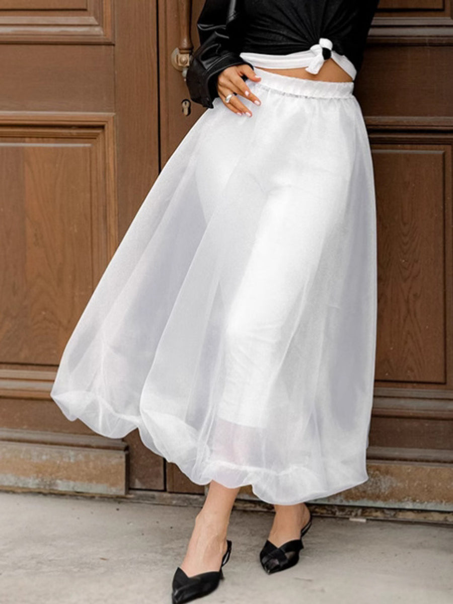 White midi skirt with sheer organza overlay and elastic waistband.