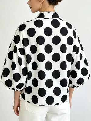 black blouse featuring collared and polka dot