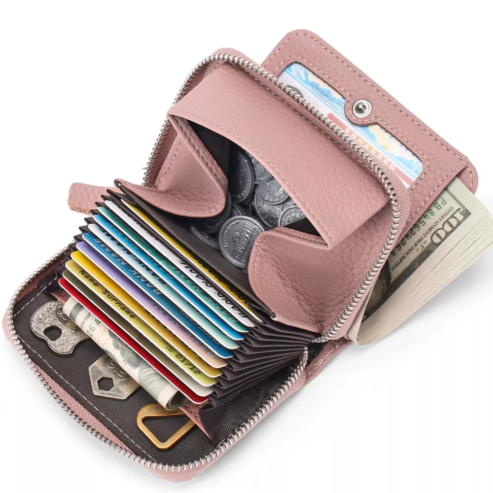 Dusty pink pebbled mini leather card wallet with multiple card slots, coin pouch, and cash compartment.