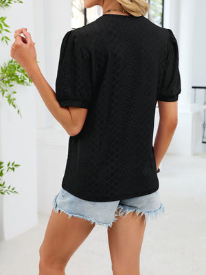Black lace trim V-neck t-shirt with puff sleeves and eyelet detail.