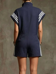 Navy blue sporty striped zip-up romper with short sleeves and pockets.