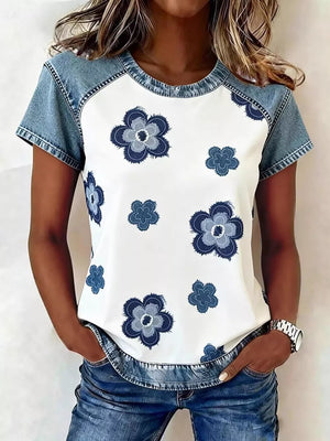 White denim patchwork blouse with blue floral print and crew neck.