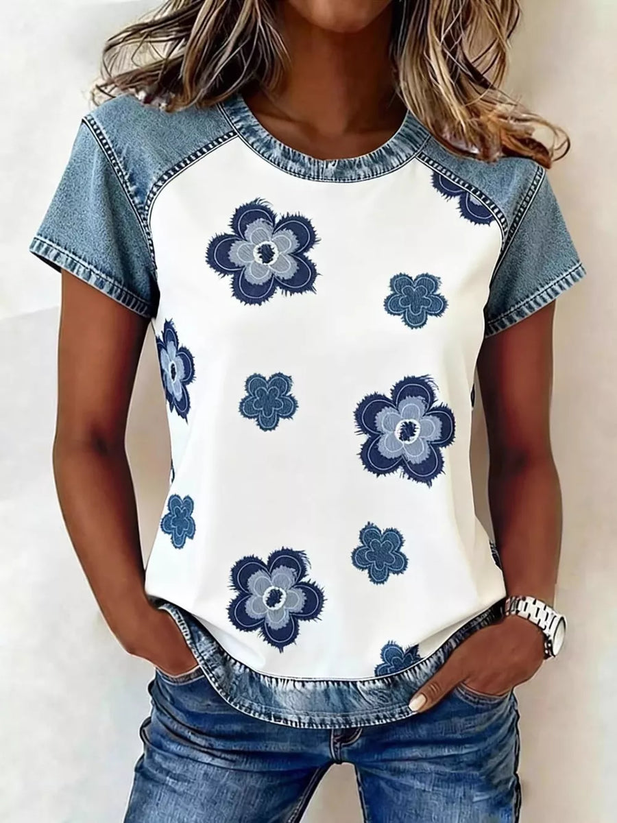 White denim patchwork blouse with blue floral print and crew neck.