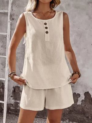 Apricot cotton two-piece set with decorative buttons on sleeveless top and matching shorts.