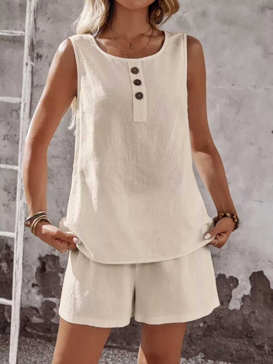 Apricot cotton two-piece set with decorative buttons on sleeveless top and matching shorts.