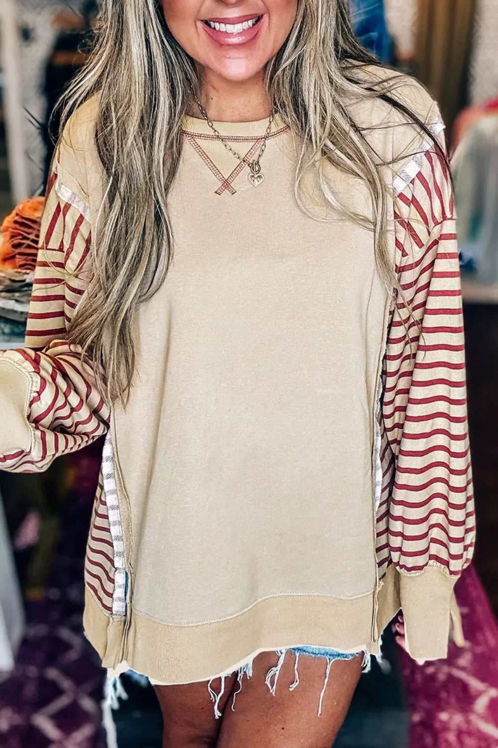 tan sweatshirt with striped and crew neck