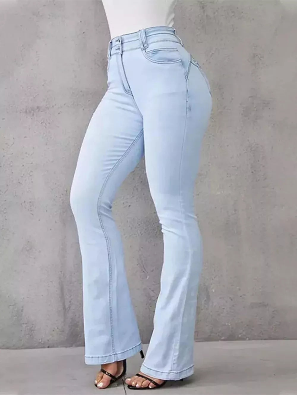 Light blue cotton spandex high-waisted flare jeans with button closure.