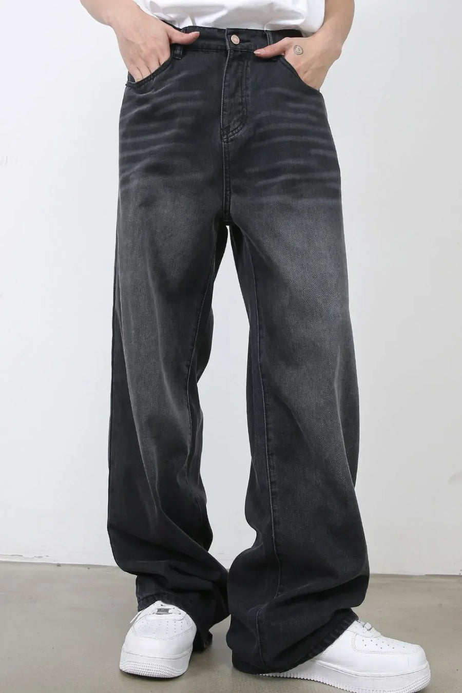 Dark gray wide leg denim jeans with a faded wash and relaxed fit.