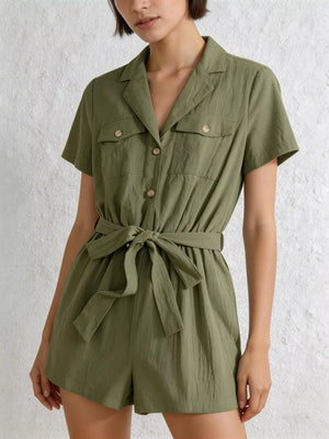 Olive green cotton utility romper with collared neckline, button-down front, chest pockets and tie waist.
