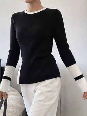 100% polyester Care instructions: Machine wash cold pullover sweater in Black with fitted silhouette