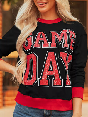 Black sweatshirt with red GAME DAY varsity graphic and red trim