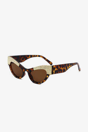 Tortoiseshell cat-eye sunglasses with crystal embellishments and brown lenses