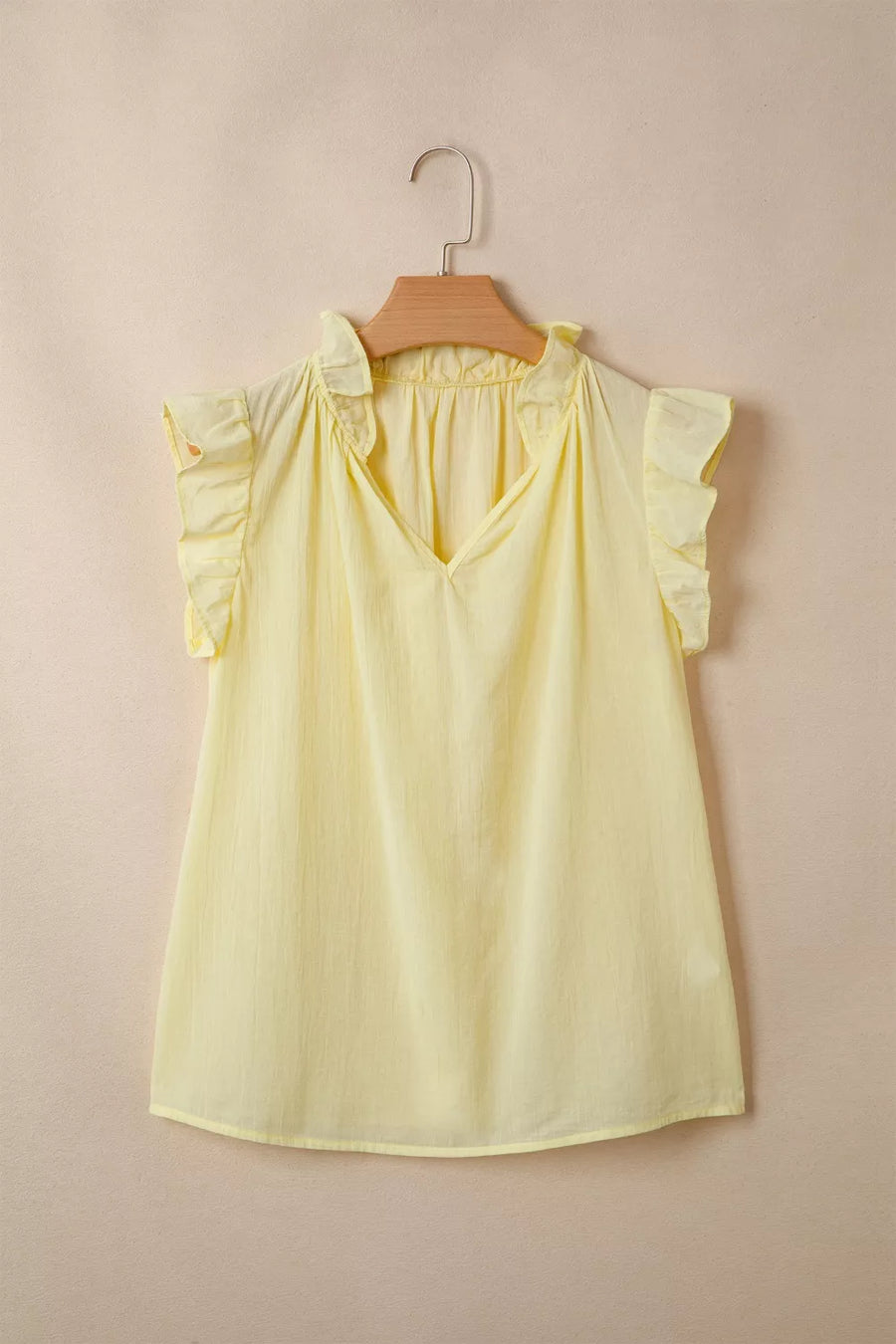 Yellow cotton blend V-neck shirt with ruffled cap sleeves and neckline