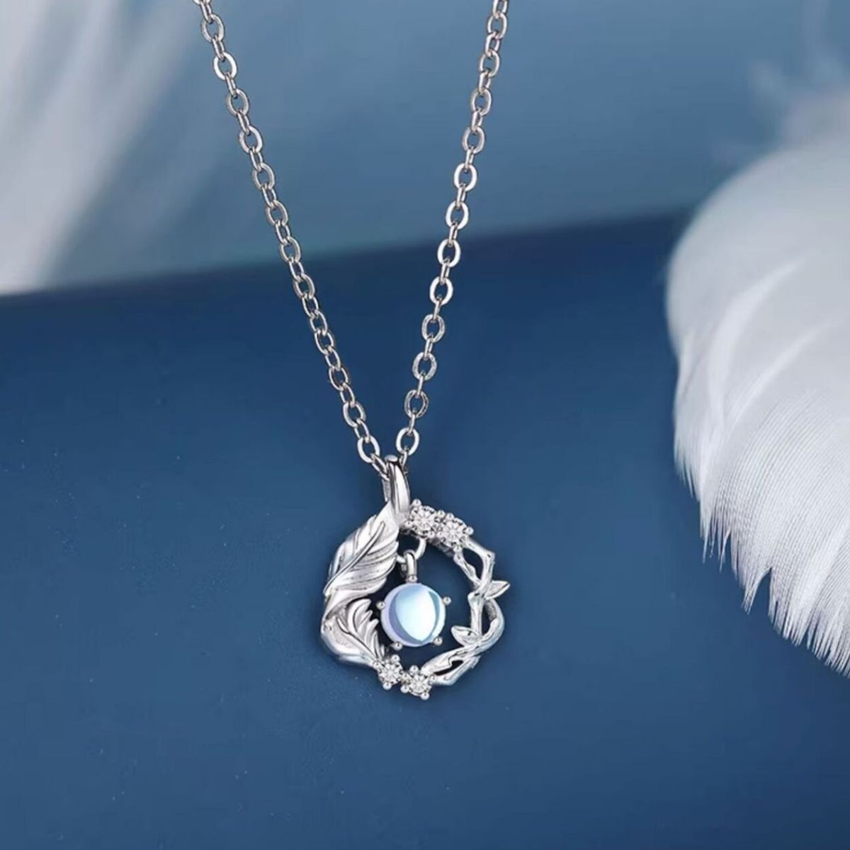 silver necklace with floral and none