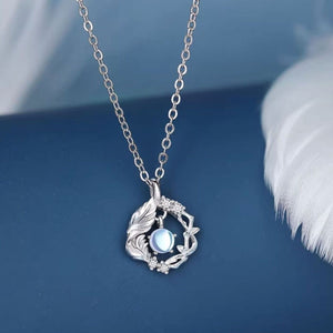 silver necklace with floral and none