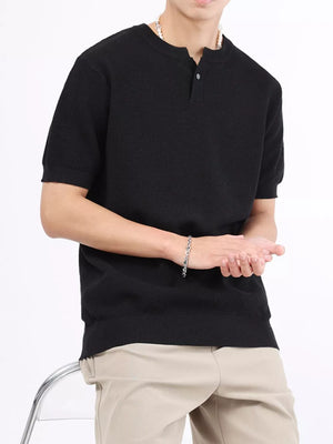 Men's black knitted henley shirt with short sleeves and a button placket.