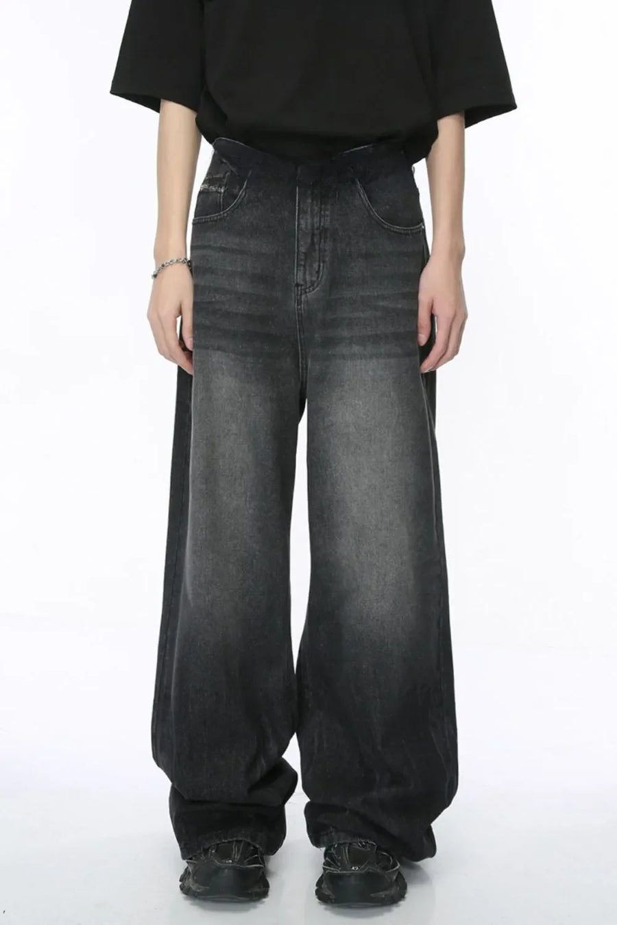 Oversized dark wash denim palazzo trousers with a wide leg and ombre effect.
