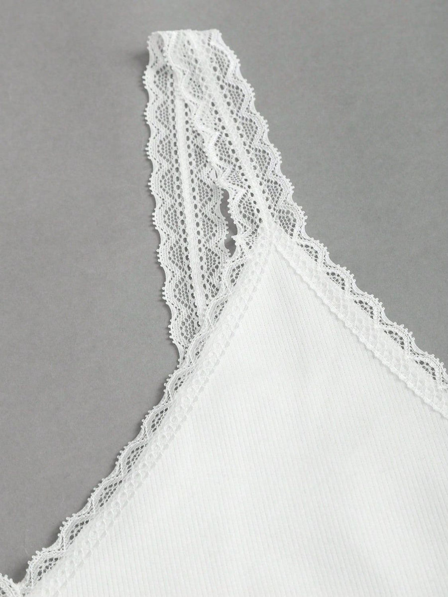 White lace trim camisole with delicate lace straps and neckline detail.