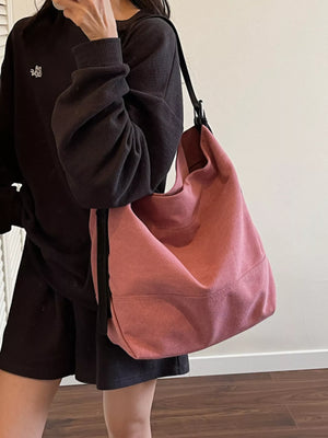 Pink hobo bag with adjustable strap and casual style