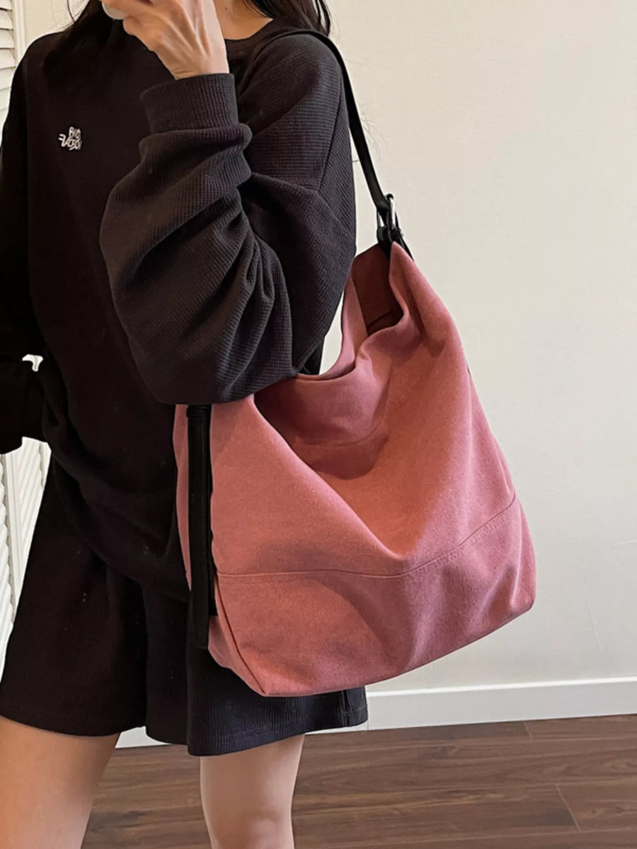 Pink hobo bag with adjustable strap and casual style