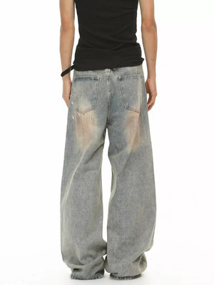 Relaxed fit vintage wash jeans in blue denim with distressed details and a baggy cut.