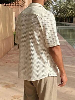 Open-knit herringbone resort shirt in ivory with short sleeves and a collared neckline.