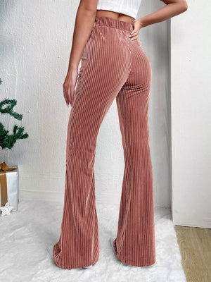 Dusty Pink corduroy maternity flare pants with high waist and bell bottoms.