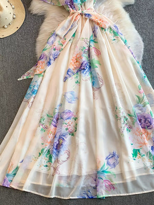 Botanical off-shoulder A-line dress in cream with floral print and belted waist.