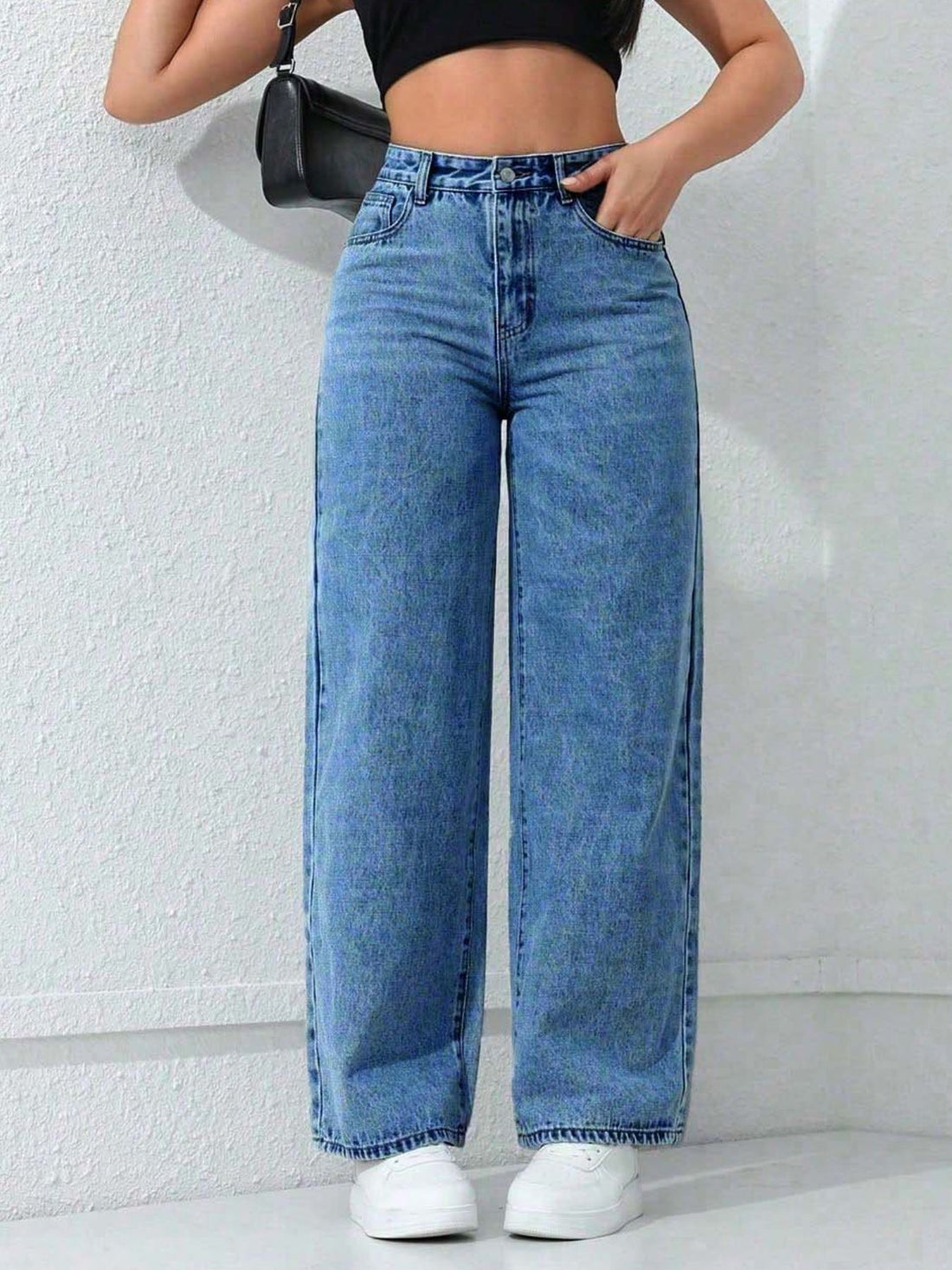 wide-leg jeans in medium blue featuring pocketed and flared fit