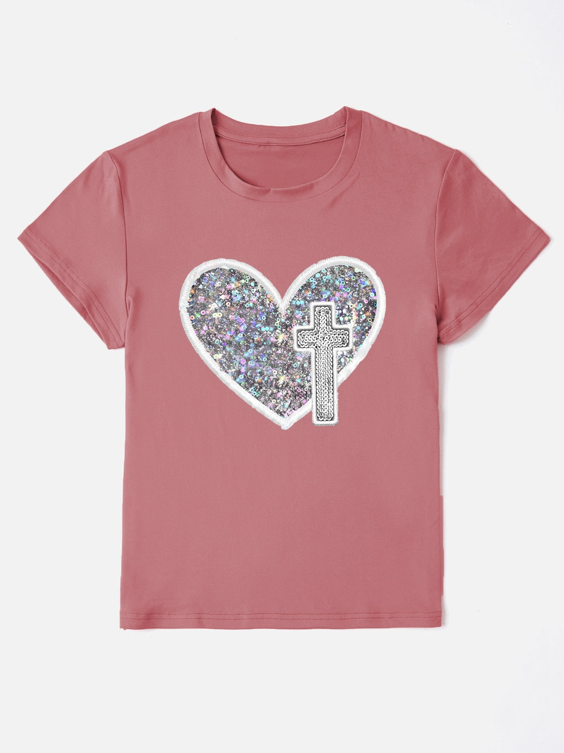 Dusty pink t-shirt with iridescent heart and cross appliqué detail.