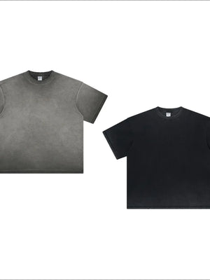 Washed black and dark gray oversized t-shirts with crew necks and short sleeves.