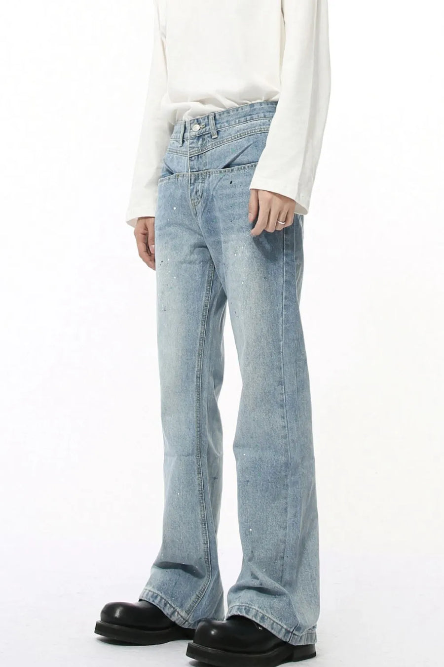 Light wash flare jeans with double waistline and splatter detail