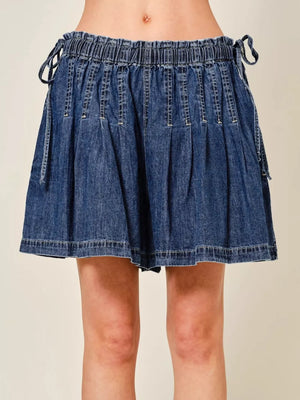 Dark blue denim-effect shorts with ruched waist and tie details.