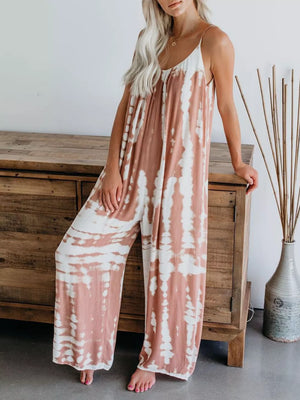 Jumpsuit with tie dye pattern, spaghetti straps, V-neck, wide leg, and flowy fit.