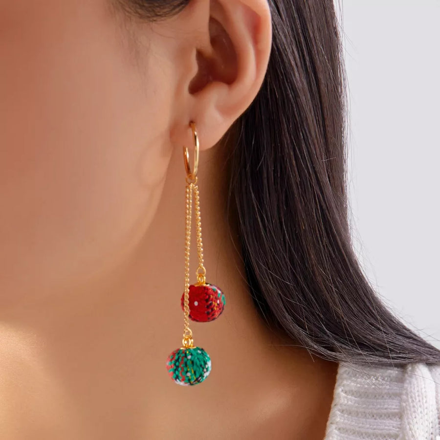 red earrings featuring gold-plated and speckled