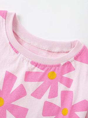 Baby girls pink cotton t-shirt with large pink floral print and crew neck.