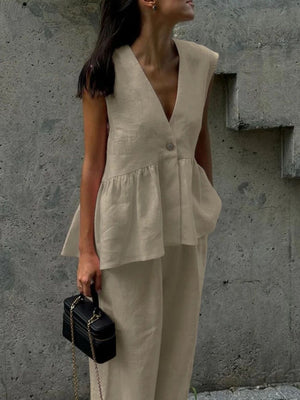 Khaki sleeveless peplum top and wide-leg pants set with V-neck and button detail.