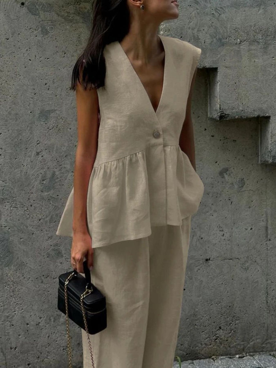 Khaki sleeveless peplum top and wide-leg pants set with V-neck and button detail.