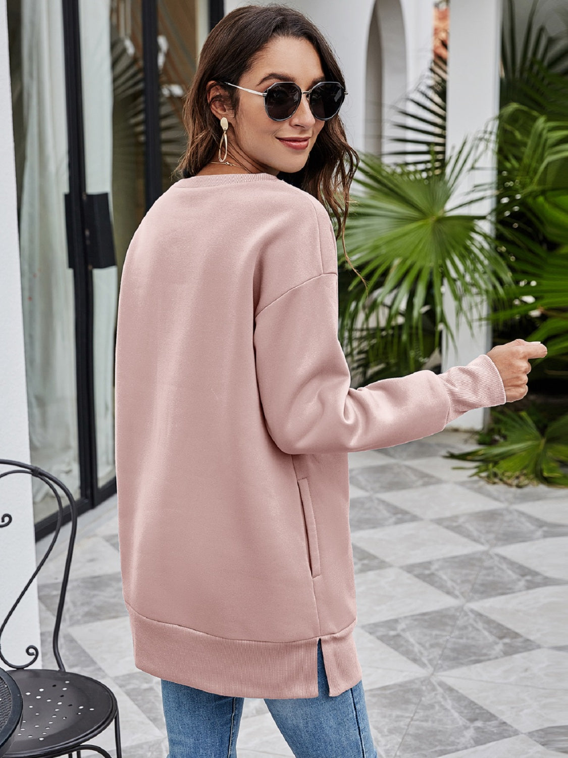 Dusty Pink Christmas graphic tunic sweatshirt with crew neck, long sleeves, side pockets, and side slits.