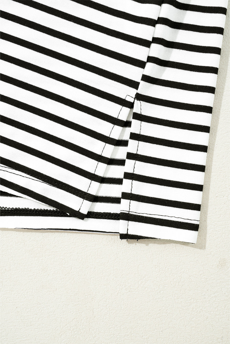 Black and white striped t-shirt with side slit detail