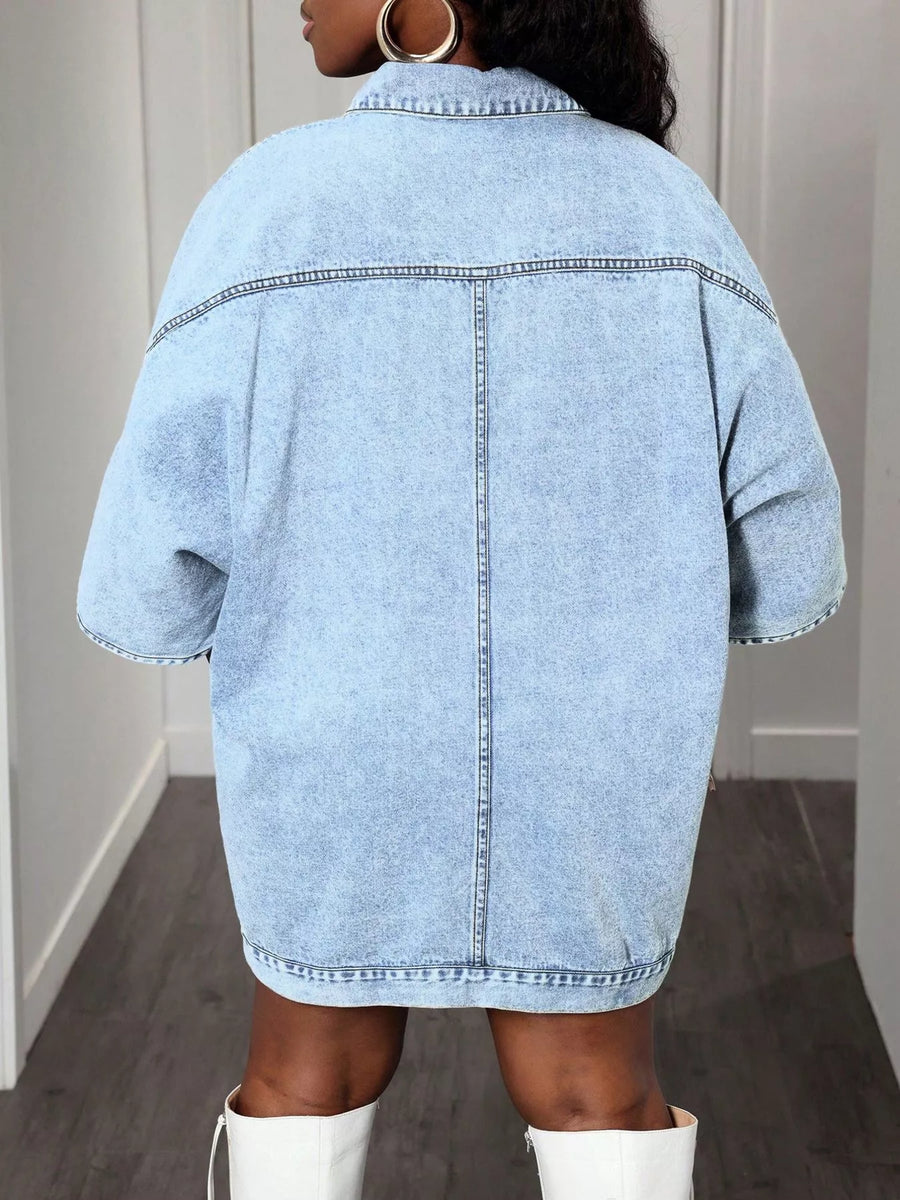 Sky blue oversized denim batwing dress with buttoned front and short sleeves.