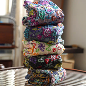 black socks featuring patterned and fruit-print